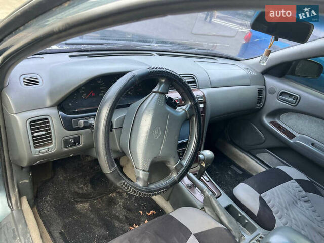 Зелений Ніссан Максіма, об'ємом двигуна 2 л та пробігом 470 тис. км за 1999 $, фото 6 на Automoto.ua