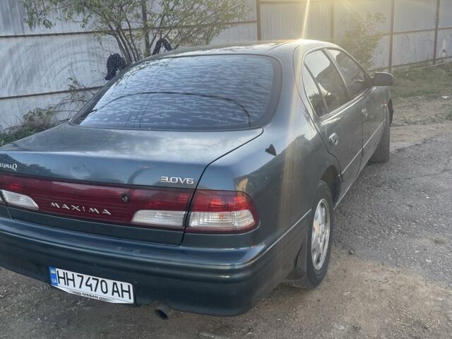 Зеленый Ниссан Максима, объемом двигателя 3 л и пробегом 258 тыс. км за 2450 $, фото 2 на Automoto.ua