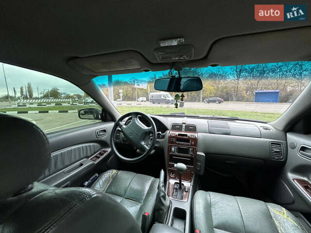 Зеленый Ниссан Максима, объемом двигателя 3 л и пробегом 326 тыс. км за 3700 $, фото 8 на Automoto.ua