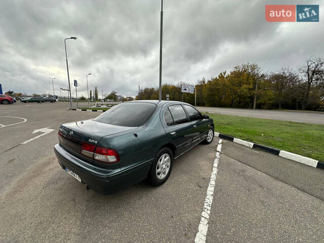 Зеленый Ниссан Максима, объемом двигателя 3 л и пробегом 326 тыс. км за 3700 $, фото 5 на Automoto.ua