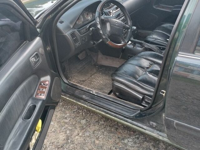 Зеленый Ниссан Максима, объемом двигателя 3 л и пробегом 300 тыс. км за 2600 $, фото 4 на Automoto.ua