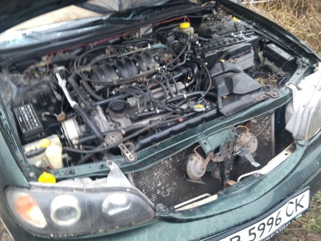 Зелений Ніссан Максіма, об'ємом двигуна 3 л та пробігом 444 тис. км за 1111 $, фото 5 на Automoto.ua