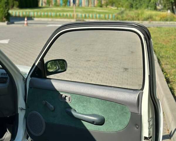 Белый Ниссан Микра, объемом двигателя 1 л и пробегом 190 тыс. км за 5999 $, фото 20 на Automoto.ua