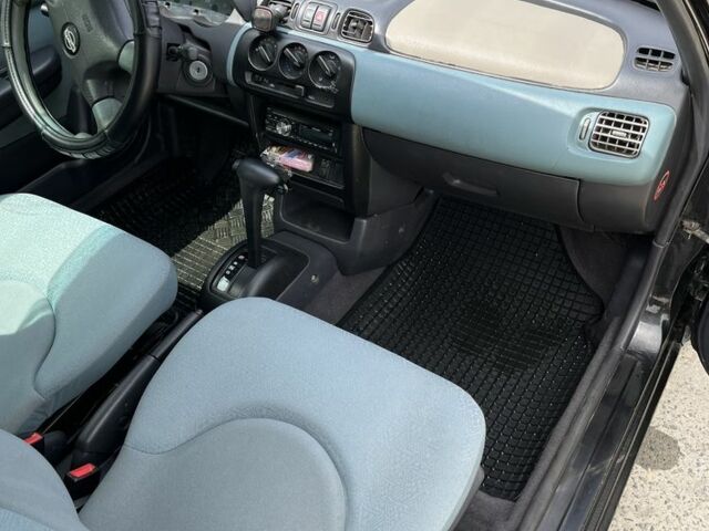 Черный Ниссан Микра, объемом двигателя 1 л и пробегом 260 тыс. км за 2800 $, фото 6 на Automoto.ua