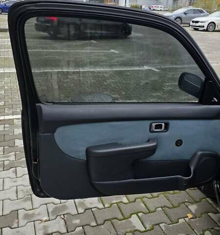 Черный Ниссан Микра, объемом двигателя 1 л и пробегом 188 тыс. км за 2499 $, фото 7 на Automoto.ua