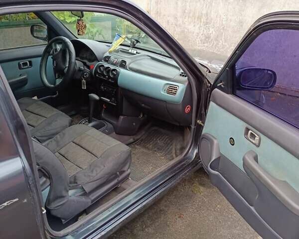 Чорний Ніссан Мікра, об'ємом двигуна 1 л та пробігом 188 тис. км за 2200 $, фото 2 на Automoto.ua