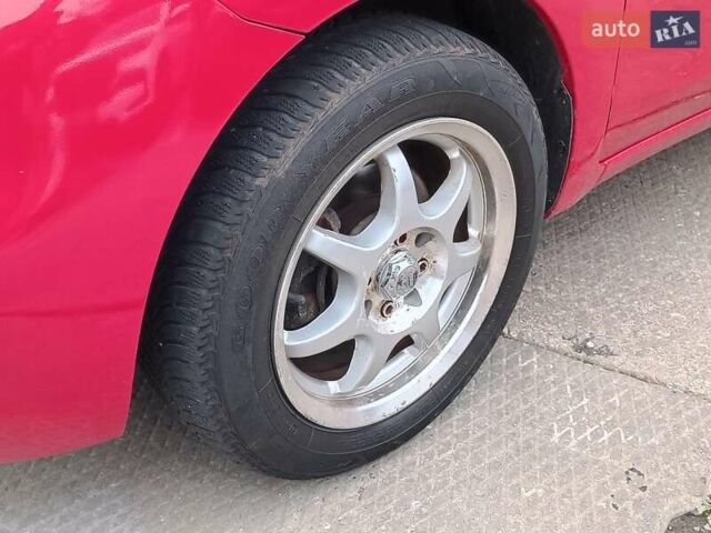 Красный Ниссан Микра, объемом двигателя 1.6 л и пробегом 50 тыс. км за 8290 $, фото 3 на Automoto.ua