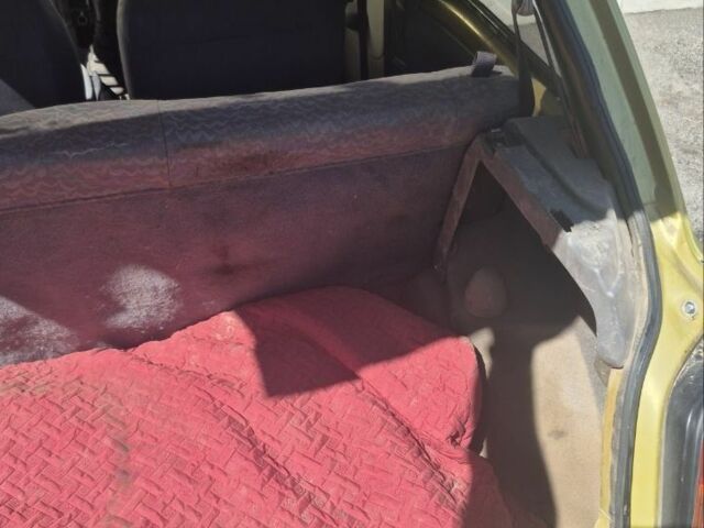 Желтый Ниссан Микра, объемом двигателя 1 л и пробегом 242 тыс. км за 699 $, фото 11 на Automoto.ua