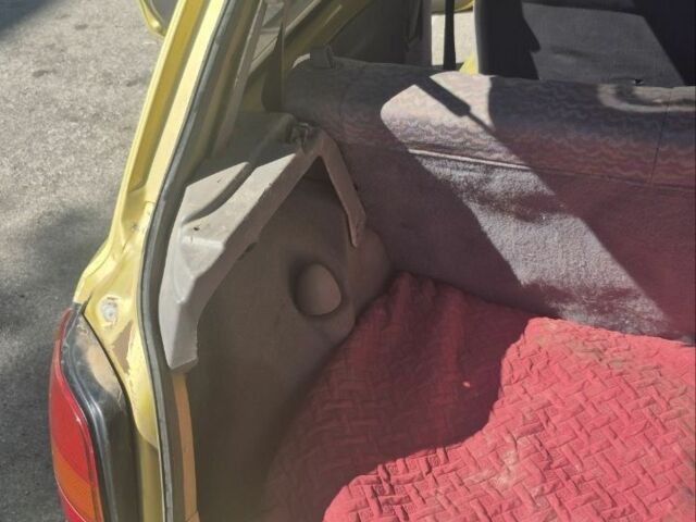 Желтый Ниссан Микра, объемом двигателя 1 л и пробегом 242 тыс. км за 699 $, фото 10 на Automoto.ua