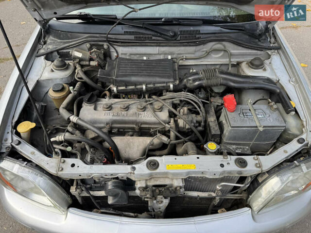 Серый Ниссан Микра, объемом двигателя 1 л и пробегом 229 тыс. км за 3100 $, фото 12 на Automoto.ua