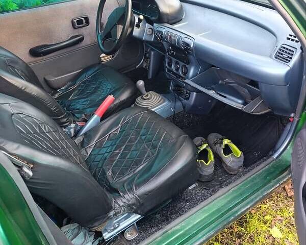 Зеленый Ниссан Микра, объемом двигателя 1 л и пробегом 77 тыс. км за 1500 $, фото 7 на Automoto.ua