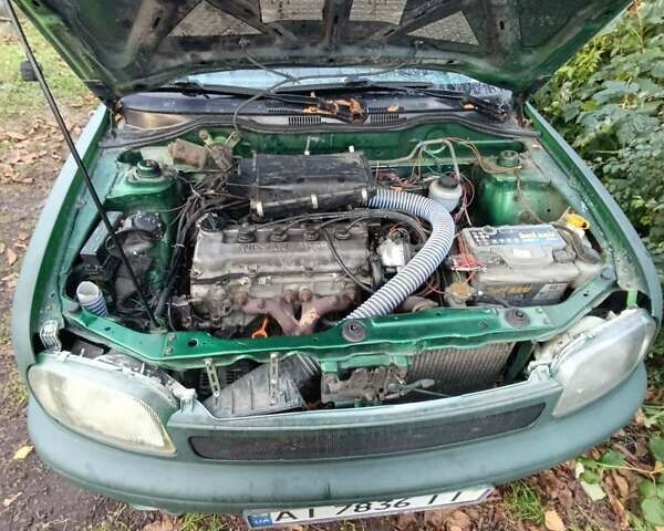 Зеленый Ниссан Микра, объемом двигателя 1 л и пробегом 77 тыс. км за 1500 $, фото 4 на Automoto.ua