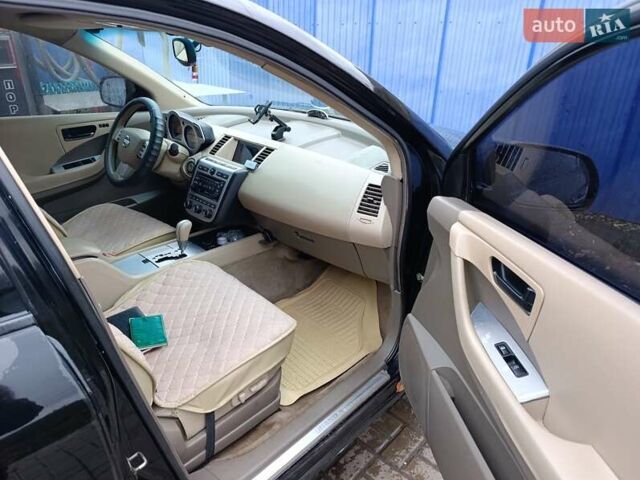 Черный Ниссан Мурано, объемом двигателя 3.5 л и пробегом 348 тыс. км за 4700 $, фото 8 на Automoto.ua