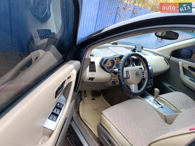 Черный Ниссан Мурано, объемом двигателя 3.5 л и пробегом 348 тыс. км за 4700 $, фото 5 на Automoto.ua