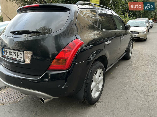 Черный Ниссан Мурано, объемом двигателя 3.5 л и пробегом 201 тыс. км за 4000 $, фото 2 на Automoto.ua