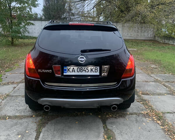 Черный Ниссан Мурано, объемом двигателя 3.5 л и пробегом 282 тыс. км за 7500 $, фото 1 на Automoto.ua