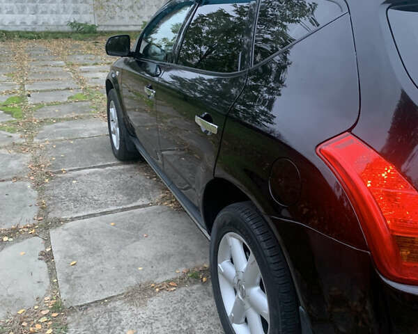 Черный Ниссан Мурано, объемом двигателя 3.5 л и пробегом 282 тыс. км за 7500 $, фото 2 на Automoto.ua