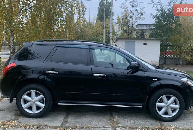 Черный Ниссан Мурано, объемом двигателя 3.5 л и пробегом 282 тыс. км за 7500 $, фото 4 на Automoto.ua