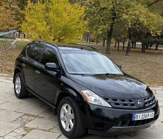 Чорний Ніссан Мурано, об'ємом двигуна 3.5 л та пробігом 259 тис. км за 4700 $, фото 3 на Automoto.ua