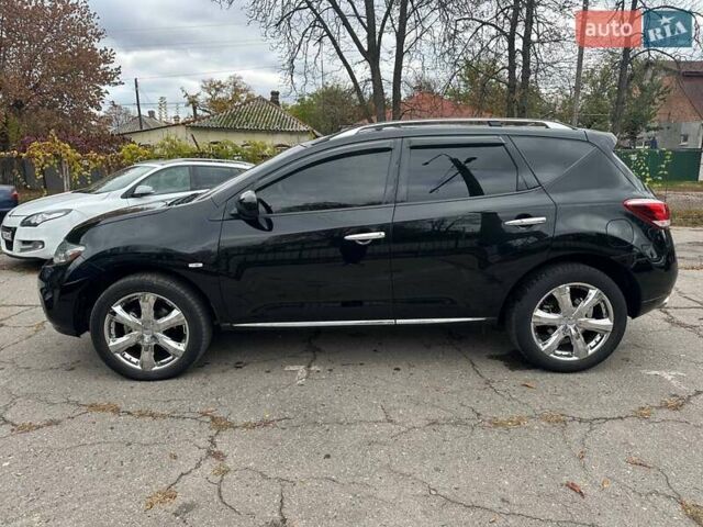 Черный Ниссан Мурано, объемом двигателя 4.25 л и пробегом 192 тыс. км за 11500 $, фото 1 на Automoto.ua