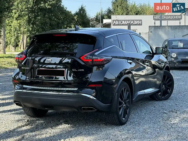 Черный Ниссан Мурано, объемом двигателя 3.5 л и пробегом 84 тыс. км за 22000 $, фото 1 на Automoto.ua