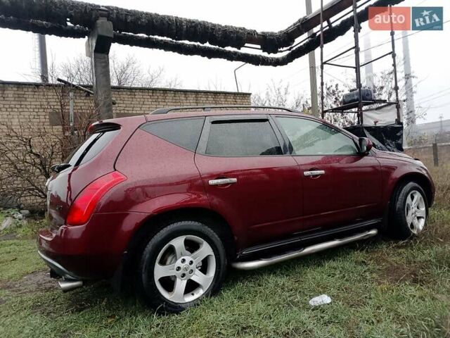 Червоний Ніссан Мурано, об'ємом двигуна 3.5 л та пробігом 270 тис. км за 5950 $, фото 4 на Automoto.ua