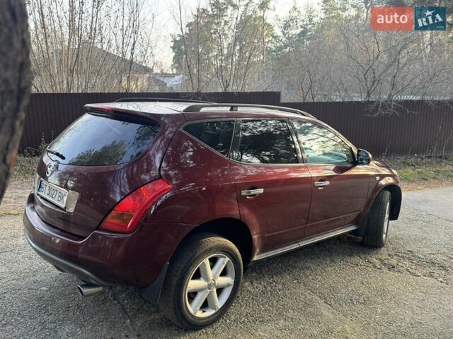 Красный Ниссан Мурано, объемом двигателя 3.5 л и пробегом 235 тыс. км за 5500 $, фото 4 на Automoto.ua