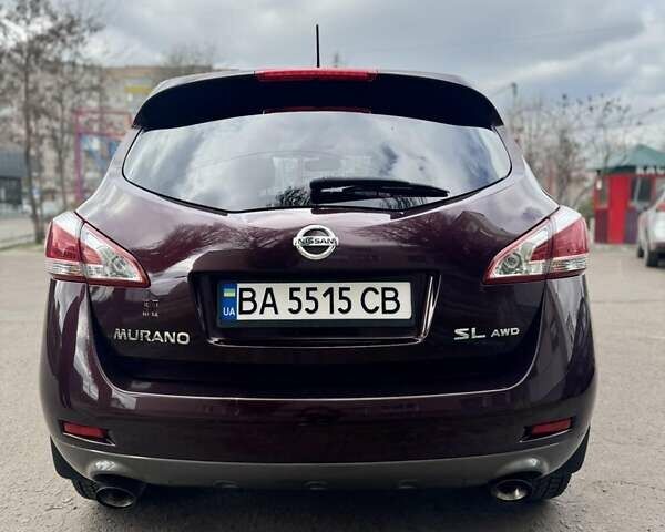 Красный Ниссан Мурано, объемом двигателя 3.5 л и пробегом 219 тыс. км за 9999 $, фото 1 на Automoto.ua