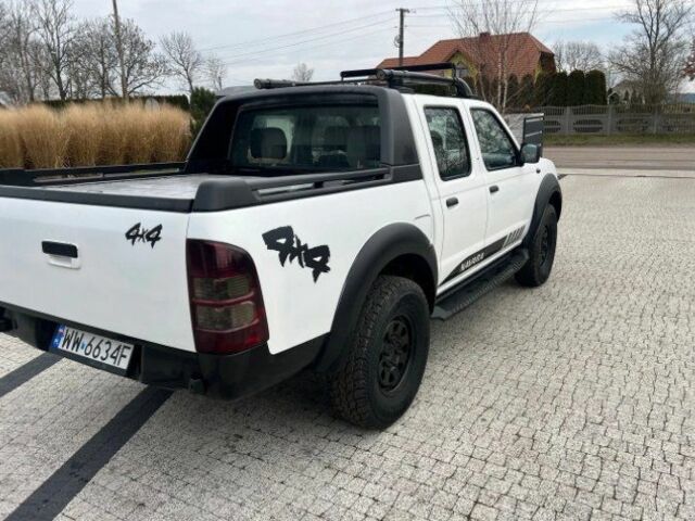 Білий Ніссан Навара, об'ємом двигуна 2.5 л та пробігом 220 тис. км за 2483 $, фото 1 на Automoto.ua