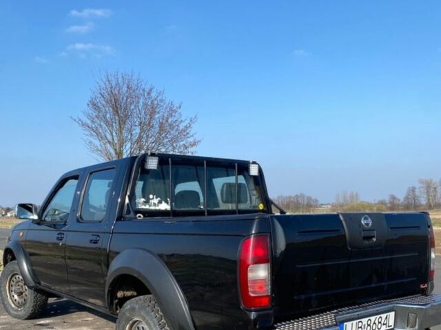 Чорний Ніссан Навара, об'ємом двигуна 2.5 л та пробігом 234 тис. км за 2680 $, фото 2 на Automoto.ua