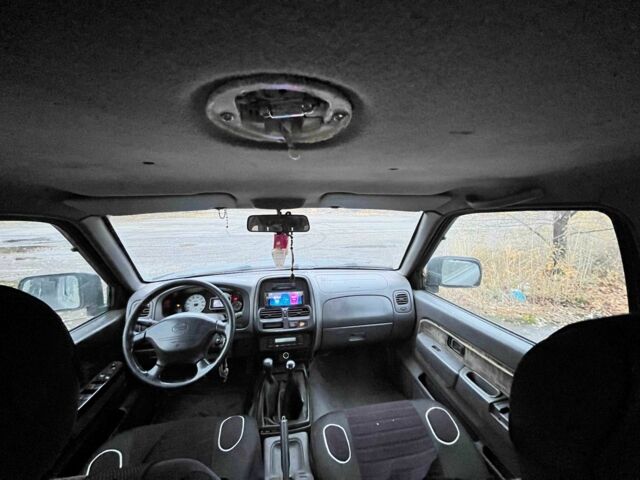 Черный Ниссан Навара, объемом двигателя 2.5 л и пробегом 400 тыс. км за 3336 $, фото 1 на Automoto.ua