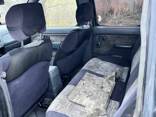 Черный Ниссан Навара, объемом двигателя 2.5 л и пробегом 400 тыс. км за 3336 $, фото 6 на Automoto.ua