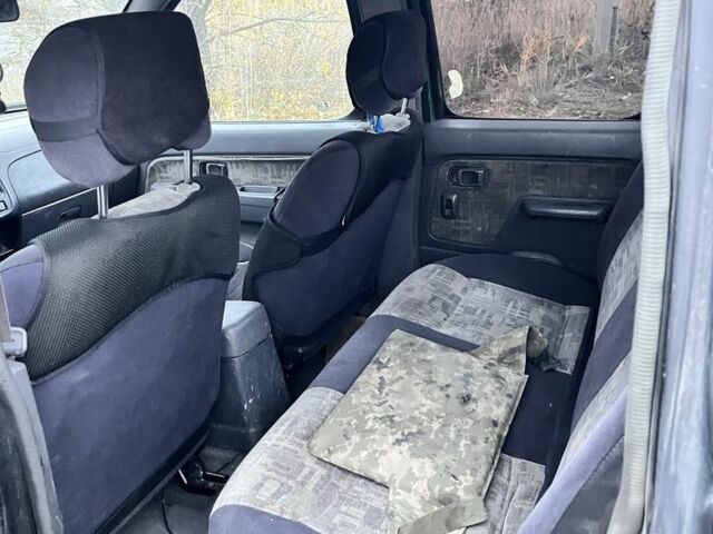 Черный Ниссан Навара, объемом двигателя 2.5 л и пробегом 165 тыс. км за 3622 $, фото 5 на Automoto.ua