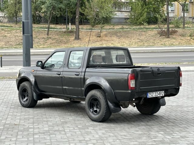 Черный Ниссан Навара, объемом двигателя 2.5 л и пробегом 297 тыс. км за 3999 $, фото 3 на Automoto.ua