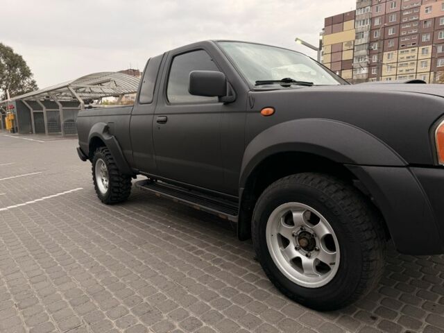 Черный Ниссан Навара, объемом двигателя 2.5 л и пробегом 200 тыс. км за 4750 $, фото 6 на Automoto.ua