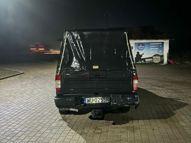 Чорний Ніссан Навара, об'ємом двигуна 3 л та пробігом 300 тис. км за 3200 $, фото 2 на Automoto.ua