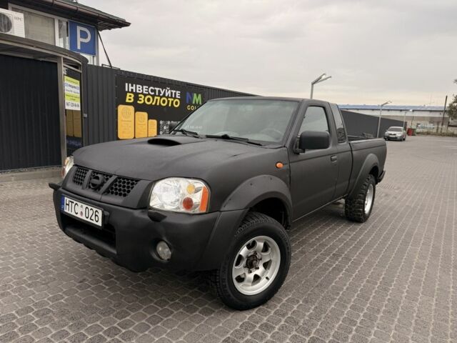 Черный Ниссан Навара, объемом двигателя 2.5 л и пробегом 200 тыс. км за 4750 $, фото 2 на Automoto.ua