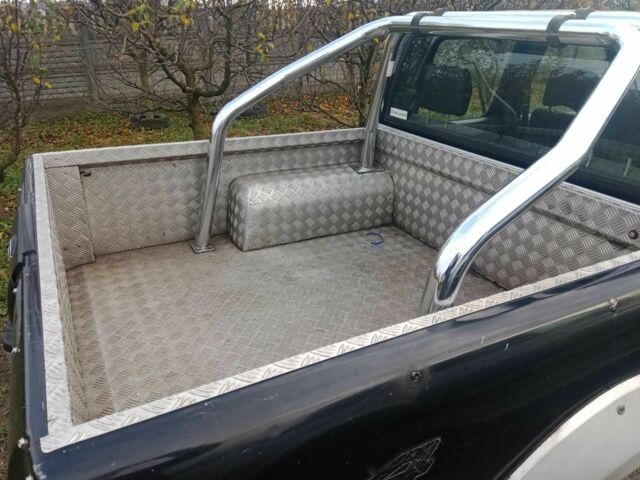 Чорний Ніссан Навара, об'ємом двигуна 2.5 л та пробігом 350 тис. км за 6174 $, фото 8 на Automoto.ua