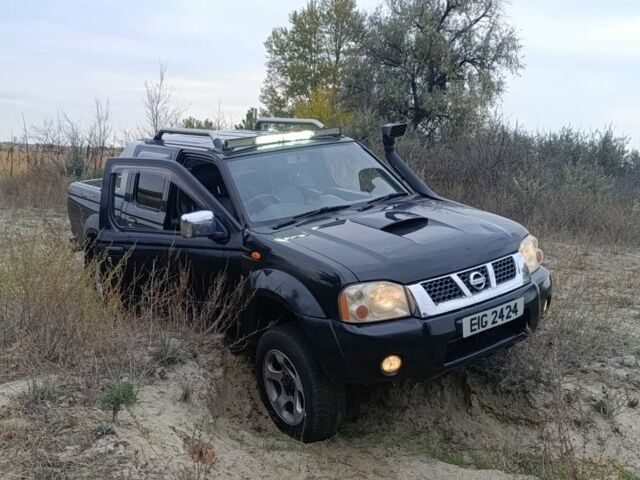 Черный Ниссан Навара, объемом двигателя 2.5 л и пробегом 100 тыс. км за 5300 $, фото 4 на Automoto.ua