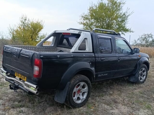 Черный Ниссан Навара, объемом двигателя 2.5 л и пробегом 100 тыс. км за 5300 $, фото 10 на Automoto.ua