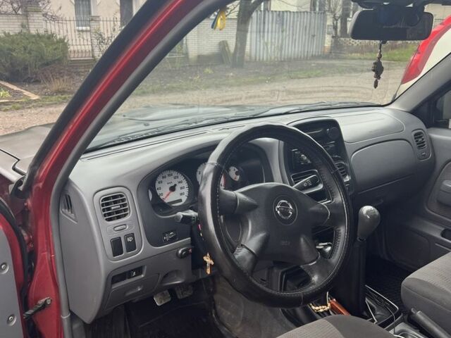 Черный Ниссан Навара, объемом двигателя 2.5 л и пробегом 213 тыс. км за 6000 $, фото 6 на Automoto.ua