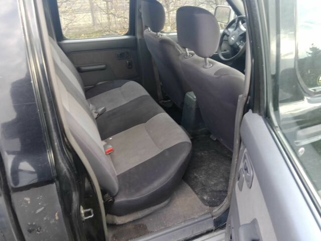 Чорний Ніссан Навара, об'ємом двигуна 2.5 л та пробігом 350 тис. км за 6174 $, фото 1 на Automoto.ua