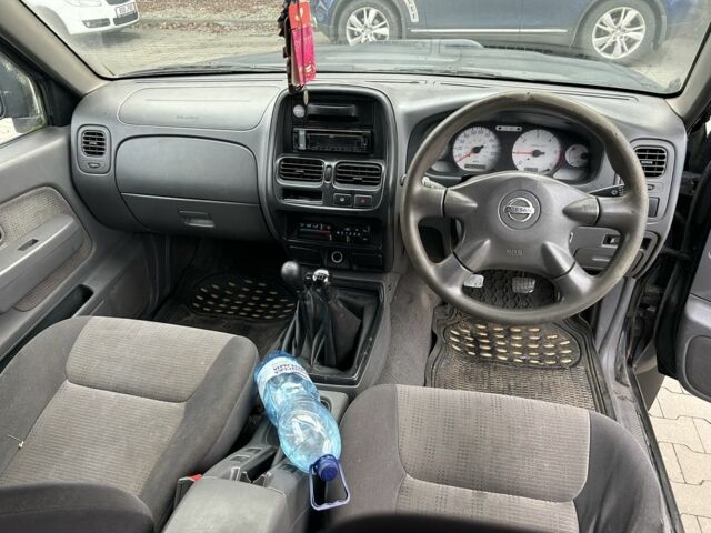 Черный Ниссан Навара, объемом двигателя 2.5 л и пробегом 220 тыс. км за 4250 $, фото 10 на Automoto.ua