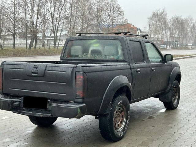 Черный Ниссан Навара, объемом двигателя 2.5 л и пробегом 200 тыс. км за 3450 $, фото 4 на Automoto.ua