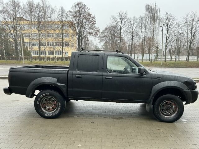 Черный Ниссан Навара, объемом двигателя 2.5 л и пробегом 200 тыс. км за 3450 $, фото 5 на Automoto.ua