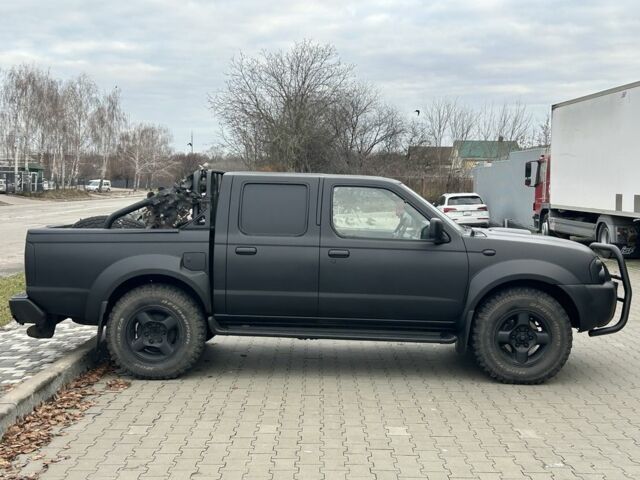 Черный Ниссан Навара, объемом двигателя 2.5 л и пробегом 220 тыс. км за 4250 $, фото 1 на Automoto.ua