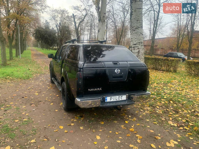 Черный Ниссан Навара, объемом двигателя 2.5 л и пробегом 260 тыс. км за 9500 $, фото 2 на Automoto.ua
