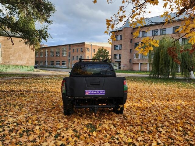 Черный Ниссан Навара, объемом двигателя 2.5 л и пробегом 260 тыс. км за 4200 $, фото 3 на Automoto.ua