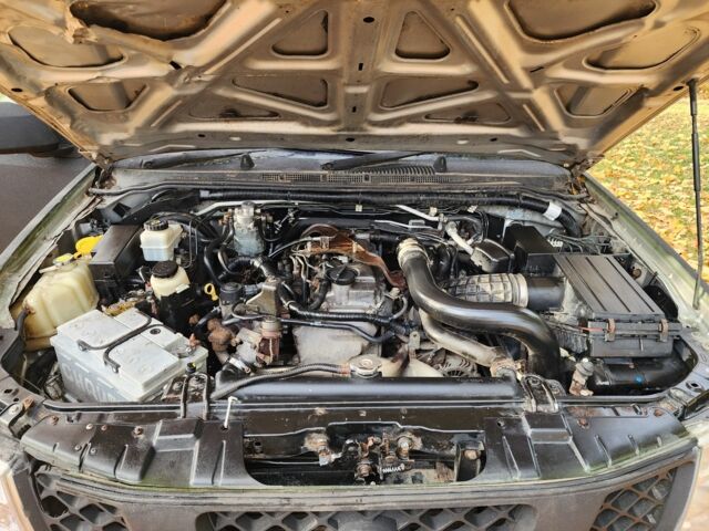 Черный Ниссан Навара, объемом двигателя 2.5 л и пробегом 260 тыс. км за 4200 $, фото 12 на Automoto.ua