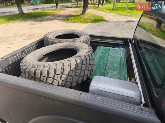 Черный Ниссан Навара, объемом двигателя 2.49 л и пробегом 313 тыс. км за 12500 $, фото 4 на Automoto.ua